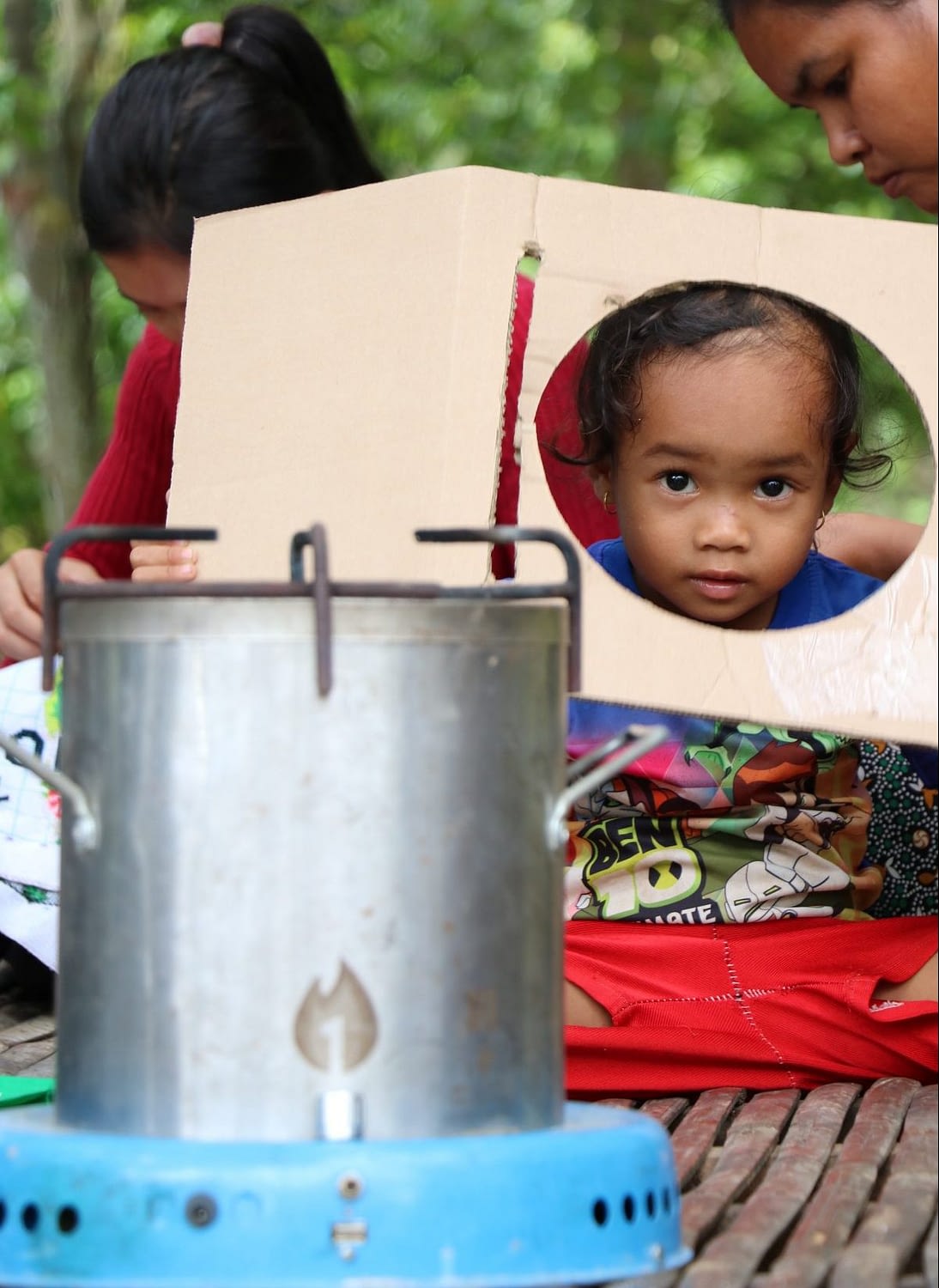 A child plays near the new, safe cookstove.