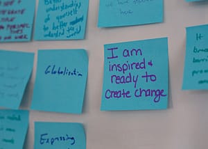 sticky note that says 'I am inspired and ready to create change'