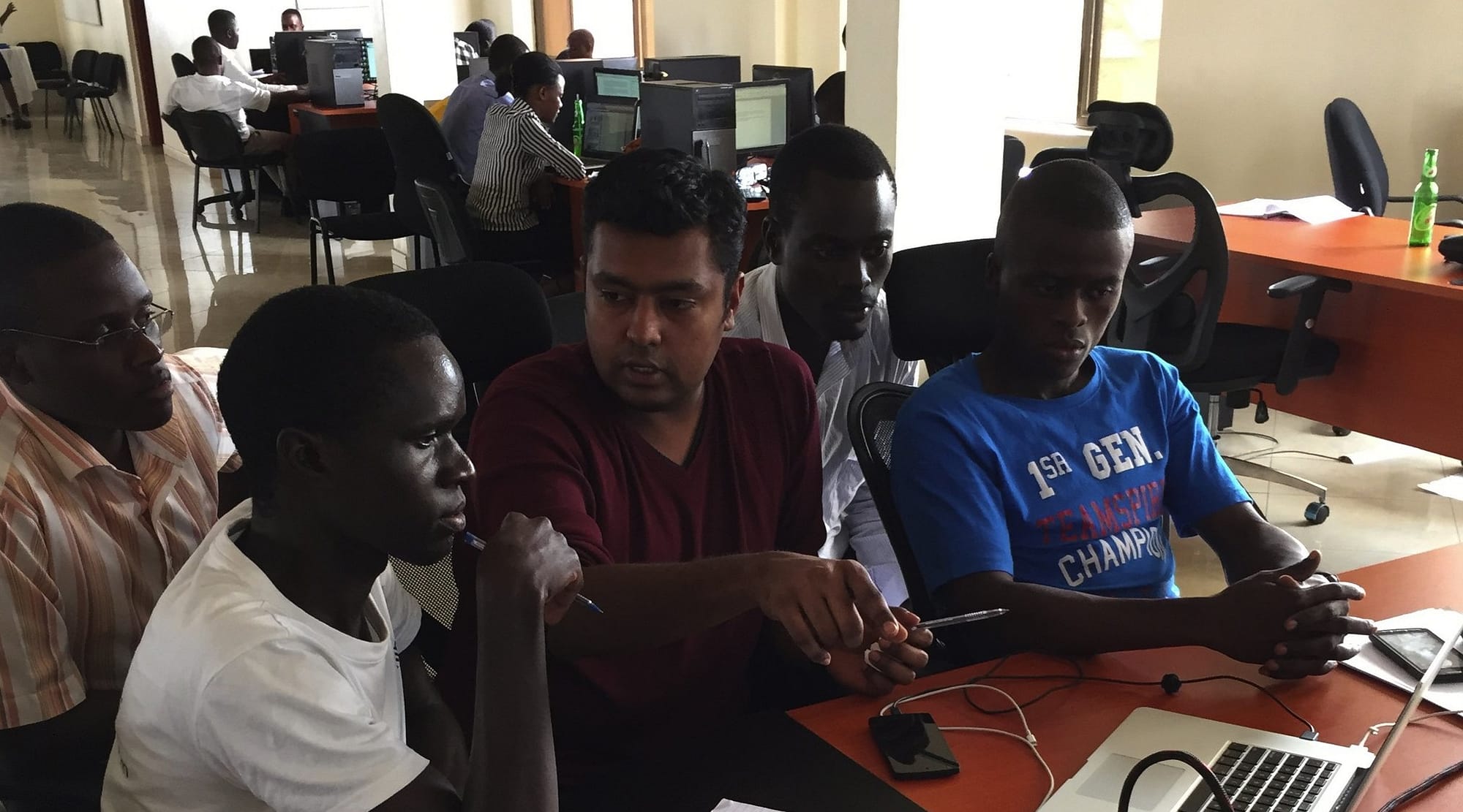 Microsoft developer Anand Mariappan, center, works with local tech-startup employees in Kampala, Uganda as part of Microsoft's International Skills-based Volunteering Program - MySkills4Afrika (Mariappan)