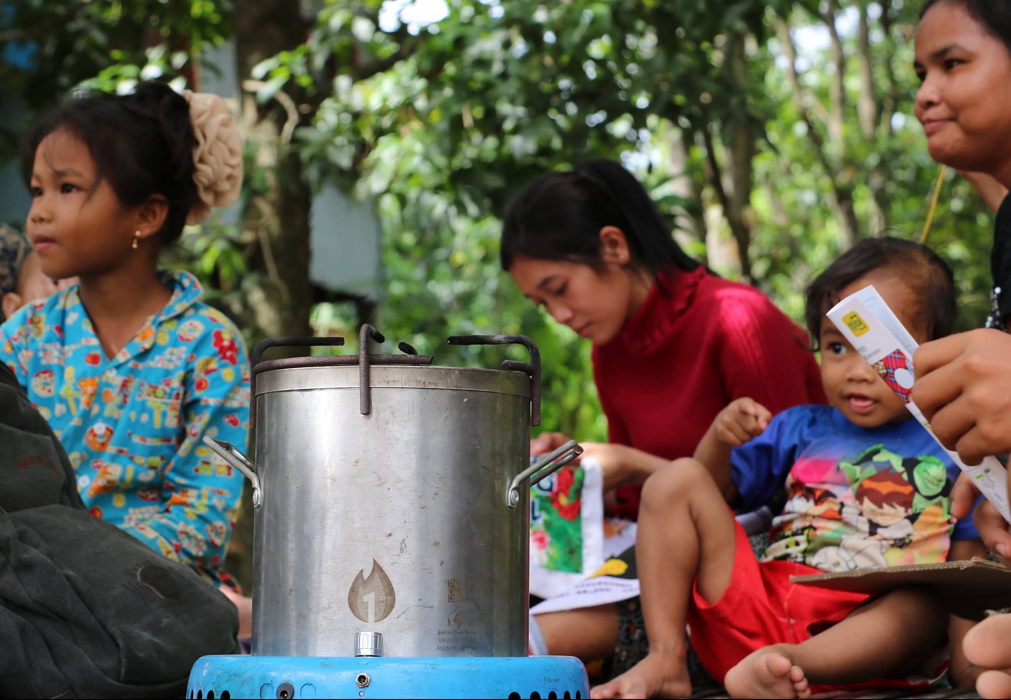 A family with their new cookstove.