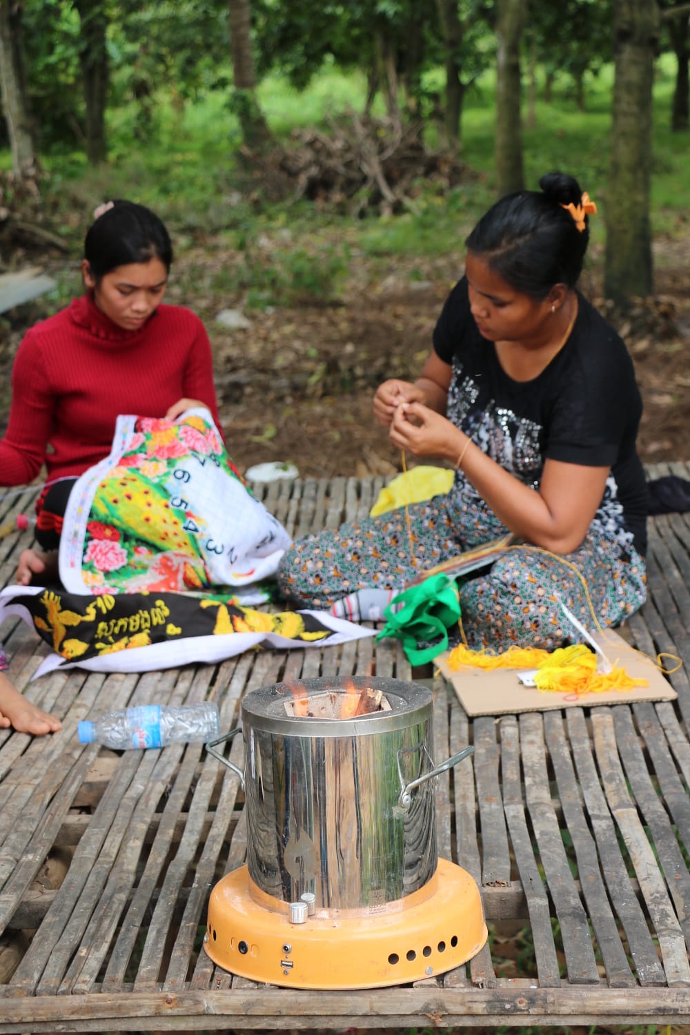 Local women with the ACE cookstove. 