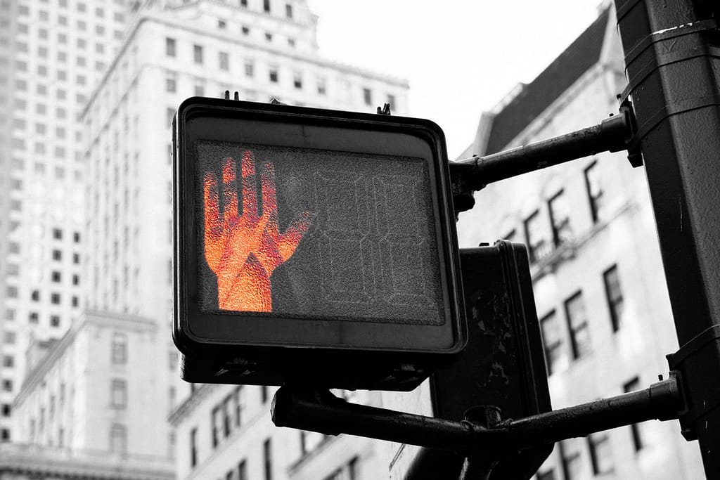Crosswalk signal with stop hand