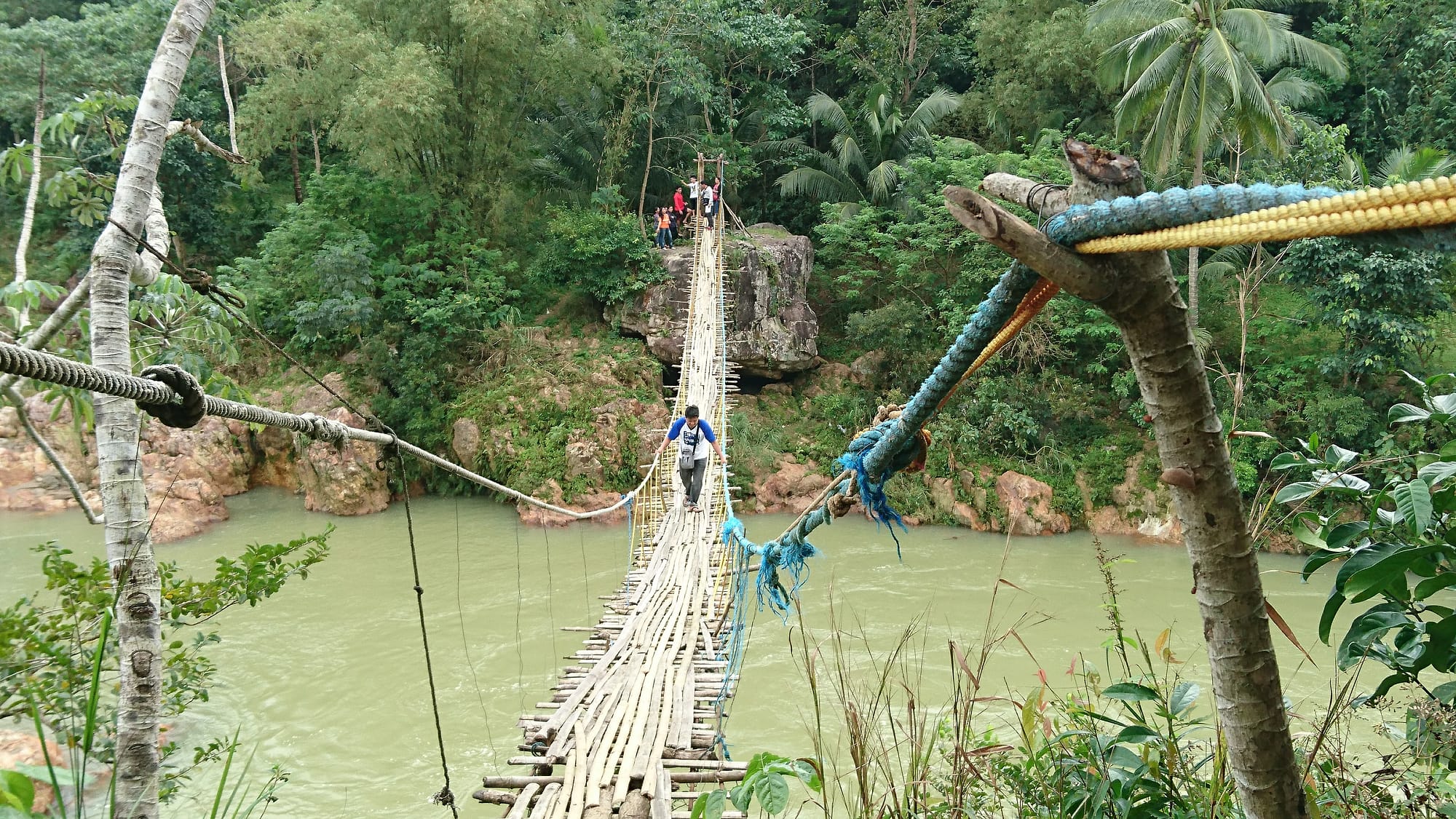 A rope bridge over a river near AIDFI.