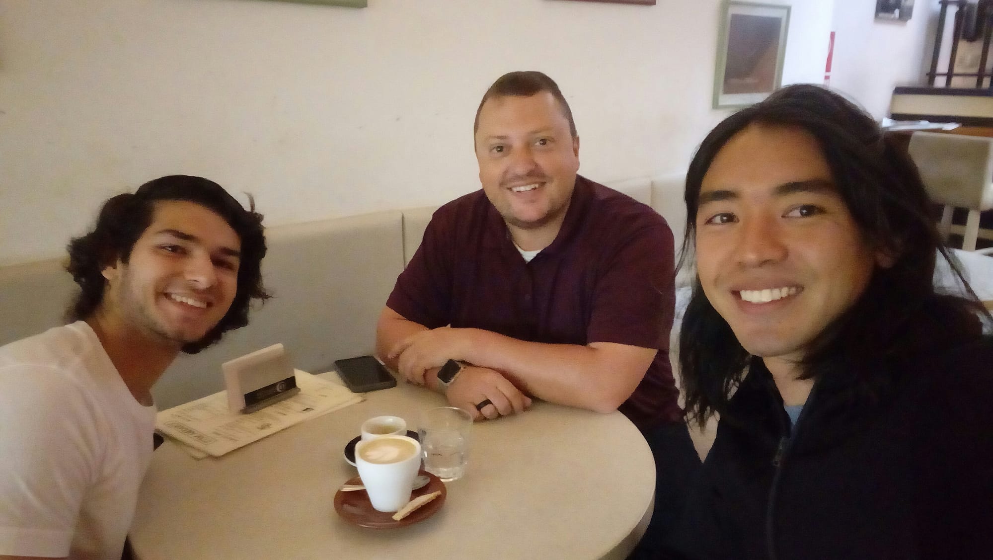 Pepe, Varun, and Jeremy at a coffee shop tasting local coffee. 
