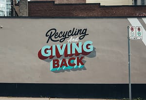 mural that reads recycling and giving back