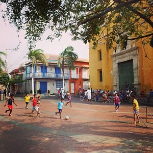 Local kids playing soccer in the streets of Medellin