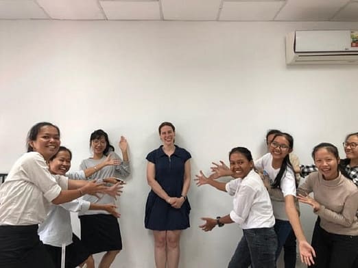 Volunteer Leanne posing with WEduShare students in Cambodia