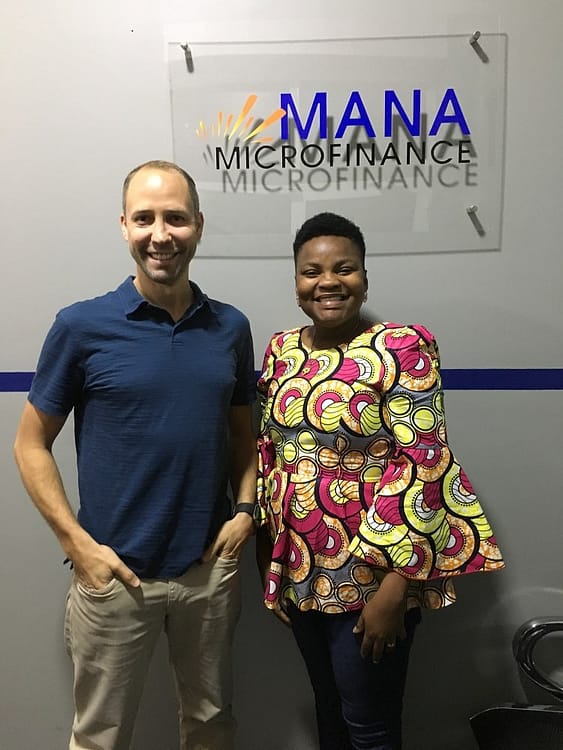 Mana Microfinance founder with volunteer Darren