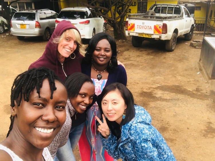 Volunteer Catherine with Flone Initiative founder and colleagues
